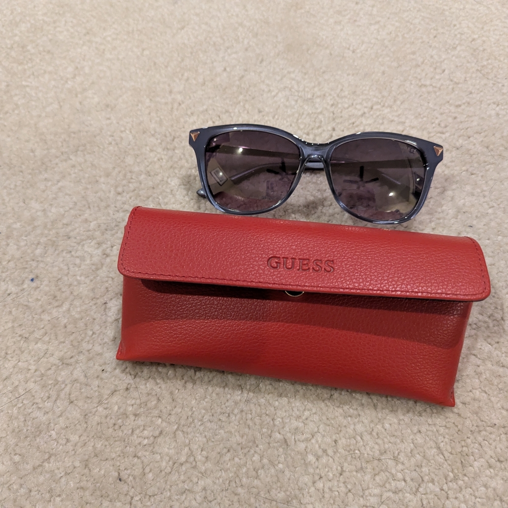 GUESS Stylish Black Sunglasses with Vibrant Red Case